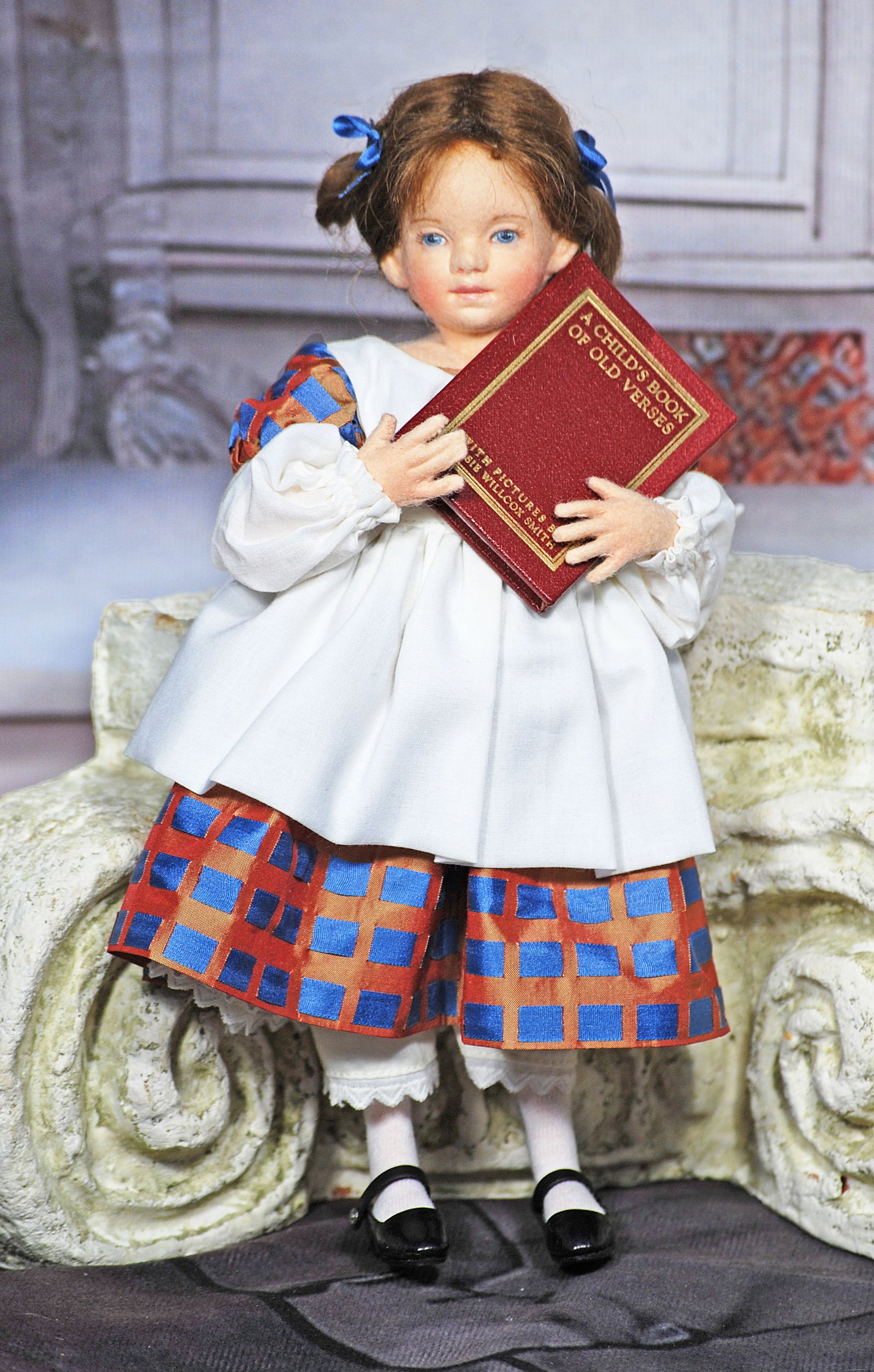 R.JOHN WRIGHT MARGARET: 122. R. JOHN WRIGHT “MARGARET”. 10”. All felt, fully-jointed with hand painted features, brunette mohair wig styled in a braided coiffure accented with blue ribbons, wearing a brown silk