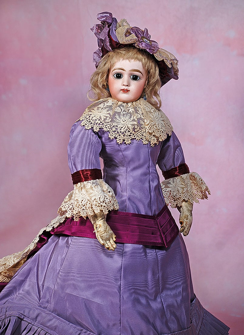 FRENCH BISQUE PORTRAIT FACE POUPEE BY JUMEAU. 18”. Marks: 7 and red artist marks. Bisque: FRENCH BISQUE PORTRAIT FACE POUPEE BY JUMEAU. 18”. Marks: 7 and red artist marks. Bisque swivel head, larger brown paperweight eyes, dark eyeliner, painted lashes, feathered and brushstroked bro