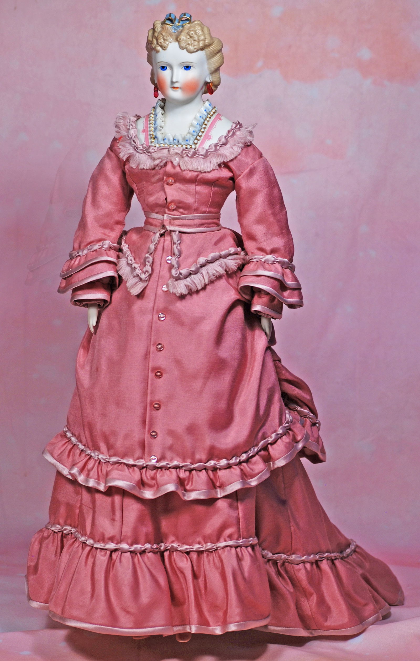 GERMAN BISQUE LADY WITH SCULPTED BROWN HAIR AND FANCY SCULPTED BODICE.  22 ½”.  Bisque (1 of 1)