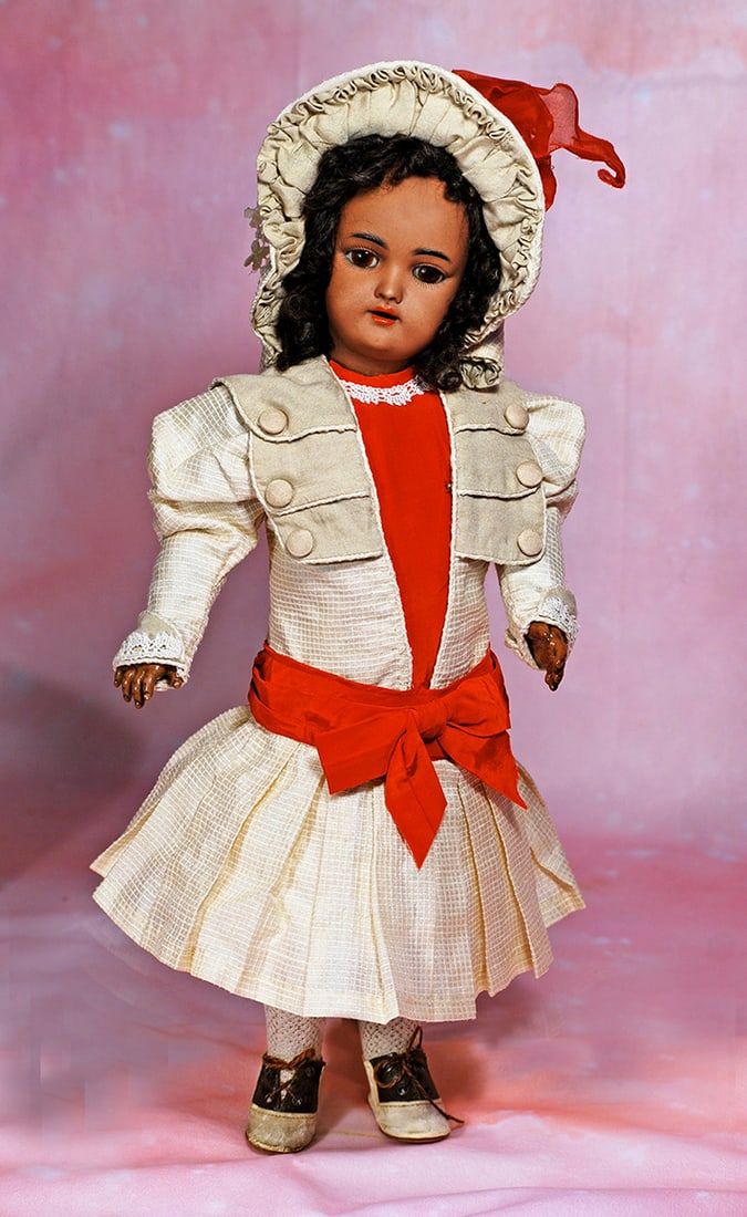 GERMAN BROWN COMPLEXIONED BISQUE DOLL BY HANDWERCK. 16”. Marks: Heinrich Handwerck/ Simon &: GERMAN BROWN COMPLEXIONED BISQUE DOLL BY HANDWERCK. 16”. Marks: Heinrich Handwerck/ Simon & Halbig, Germany. Brown bisque socket head, brown sleep eyes, painted lashes, molded and feathered blac