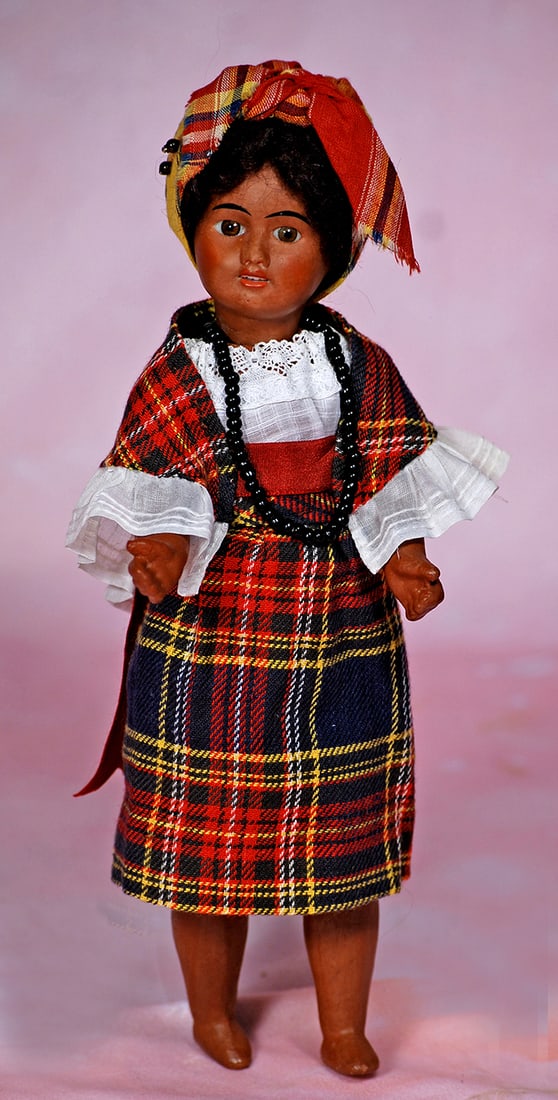 FRENCH BROWN-COMPLEXIONED BISQUE DOLL BY S.F.B.J. 10 ½”. Marks: Unis France 60. Brown: FRENCH BROWN-COMPLEXIONED BISQUE DOLL BY S.F.B.J. 10 ½”. Marks: Unis France 60. Brown bisque socket head, stationary brown glass eyes, arched black brows, open mouth, shaded lips, upper tee