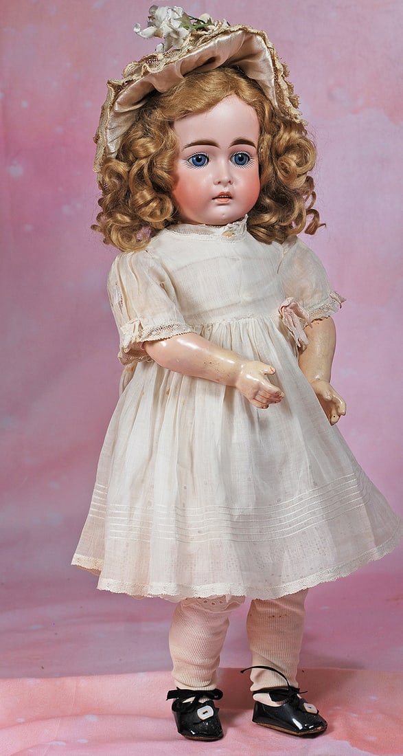EARLY GERMAN BISQUE CHILD BY KESTNER. 19”. Marks: 12. Bisque socket head, blue sleep eyes,: EARLY GERMAN BISQUE CHILD BY KESTNER. 19”. Marks: 12. Bisque socket head, blue sleep eyes, painted lashes, eyeliner, feathered brows, open mouth with accented lips, upper teeth, blonde mohair wi