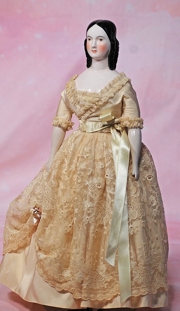 PORCELAIN PORTRAIT DOLL AS JENNY LIND BY ARTIST CLAIRE WADE. 18”. Marks: Clairmaid 1961.: PORCELAIN PORTRAIT DOLL AS JENNY LIND BY ARTIST CLAIRE WADE. 18”. Marks: Clairmaid 1961. Pink toned porcelain shoulder head with sculpted black hair in the Jenny Lind style, painted features, br