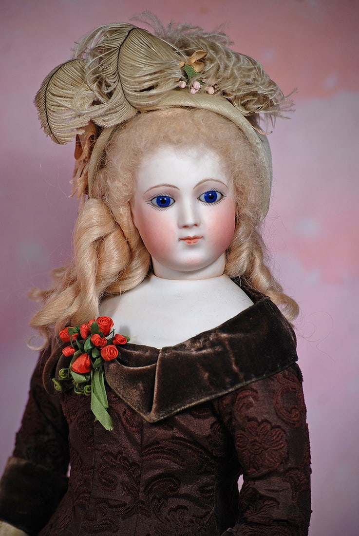 FRENCH BISQUE POUPEE WITH PORTRAIT-LIKE FACE AND DEHORS NECK ARTICULATION, ATTRIBUTED TO JUMEAU. (1 of 2)