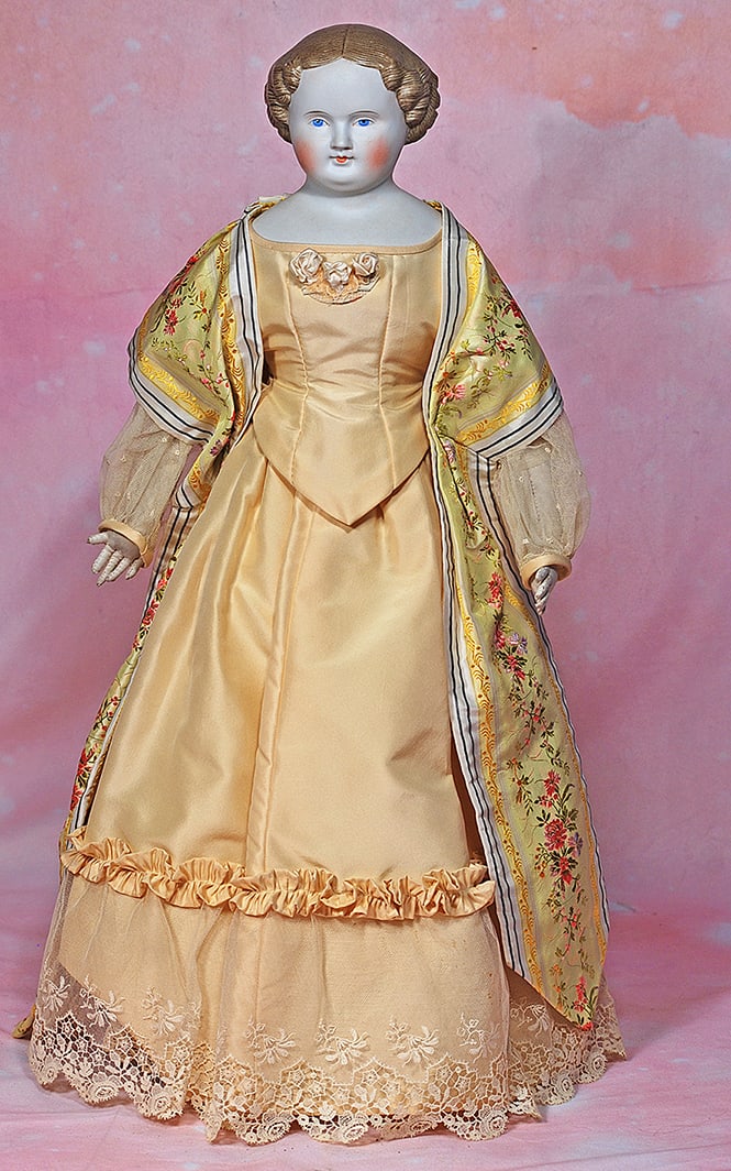 GERMAN BISQUE LADY WITH SCULPTED LIGHT BROWN HAIR. 23”. Marks: None. Bisque shoulderhead,: GERMAN BISQUE LADY WITH SCULPTED LIGHT BROWN HAIR. 23”. Marks: None. Bisque shoulderhead, sculpted brown hair with deep comb-marked detail, center-parted with short ringlet curls all around, pai