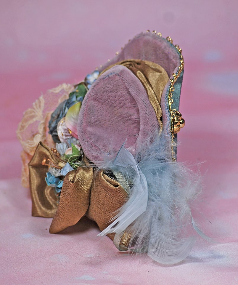 DOLL BONNET.  Pale lavender velvet bonnet has oval shaped crown, graduated upturned brim edged in (1 of 1)