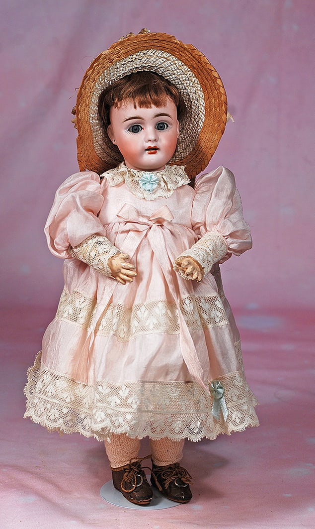PETITE GERMAN BISQUE CHILD BY MAX HANDWERCK.: PETITE GERMAN BISQUE CHILD BY MAX HANDWERCK. 13 ½”. Marks. Dep 297. Bisque socket head, blue sleep eyes, painted lashes, feathered brows, pierced ears, open mouth, accented lips, upper te