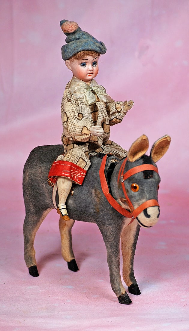 GERMAN BISQUE DOLL ON PAPER MACHE DONKEY.  11” x 9”.  Paper mache gray donkey with (1 of 1)