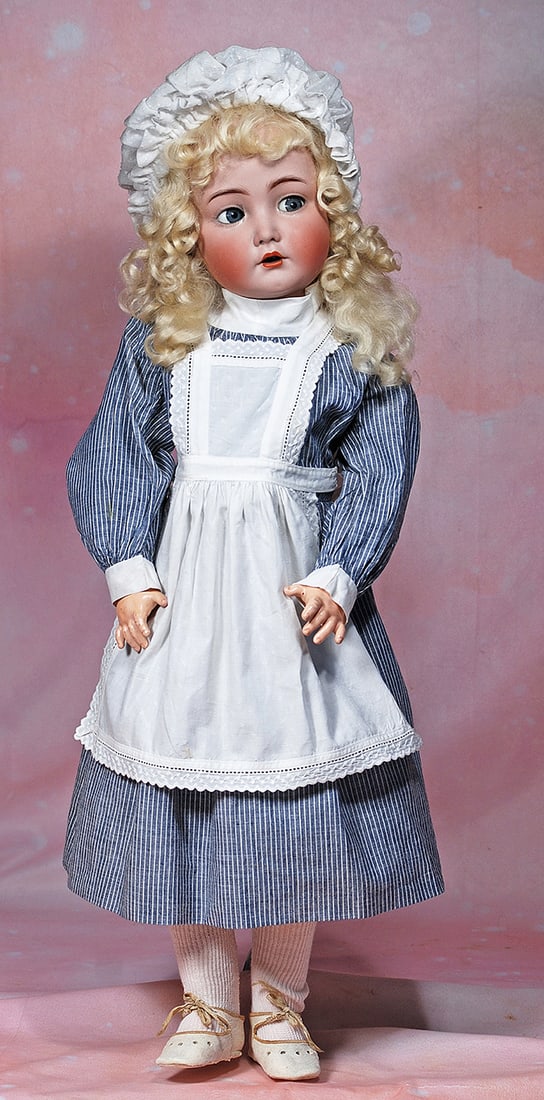 GERMAN BISQUE FLIRTY-EYED “MEIN LIEBLING: GERMAN BISQUE FLIRTY-EYED “MEIN LIEBLING” MODEL 117n BY KAMMER AND REINHARDT. 25”. Marks: K * R, Simon & Halbig 117n. Bisque socket head, blue flirty and sleep eyes, painted lashes, eyel