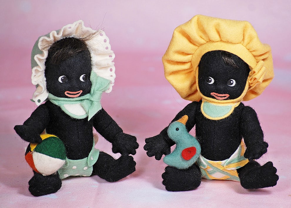 R. JOHN WRIGHT GOLLI BABY BOY AND GIRL, COLLECTORS CLUB EDITION.: R. JOHN WRIGHT GOLLI BABY BOY AND GIRL, COLLECTORS CLUB EDITION. 5". Each is of black pressed felt with painted facial features, googly eyes painted to be glancing at each other, coral lips, mohair cu