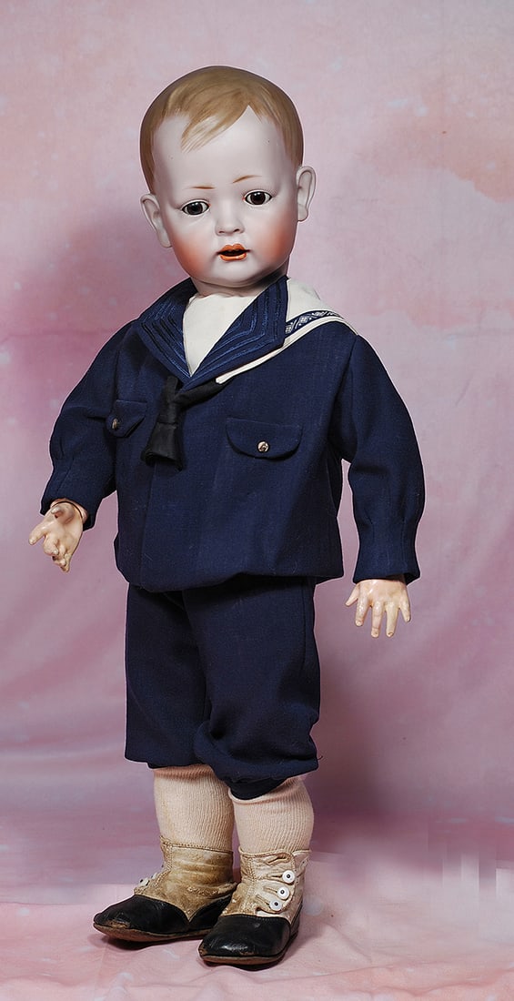 GERMAN BISQUE CHARACTER KNOWN AS TOMMY TUCKER BY BRUNO SCHMIDT.: GERMAN BISQUE CHARACTER KNOWN AS TOMMY TUCKER BY BRUNO SCHMIDT. 24”. Marks: 3. Solid-dome bisque socket head, painted brown side-parted hair, brown sleep eyes, painted lashes, feathered brows, o