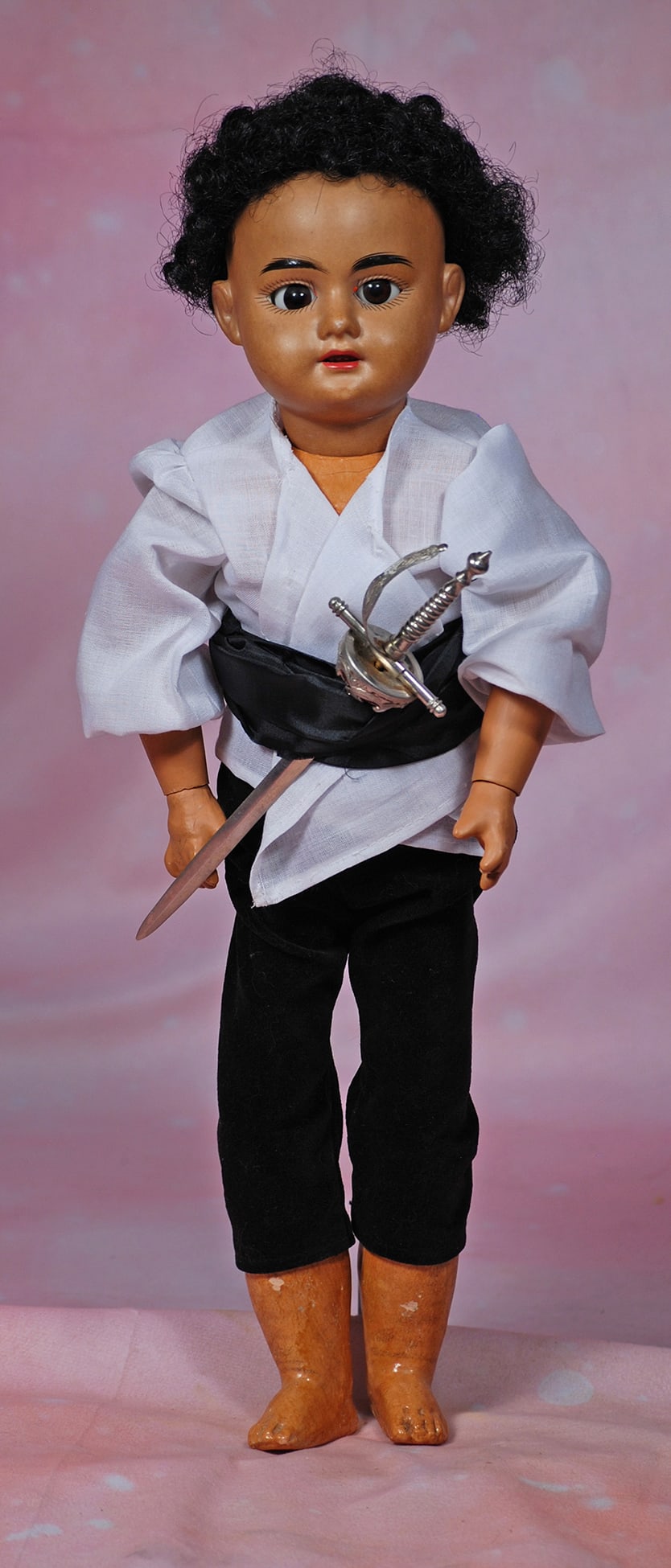 BROWN-COMPLEXIONED GERMAN BISQUE DOLL BY MARSEILLE. 1: BROWN-COMPLEXIONED GERMAN BISQUE DOLL BY MARSEILLE. 17”. Marks: 1894 A.M. Dep. Brown bisque socket head, brown sleep eyes, painted lashes, feathered brows, open mouth, upper teeth, black curly w