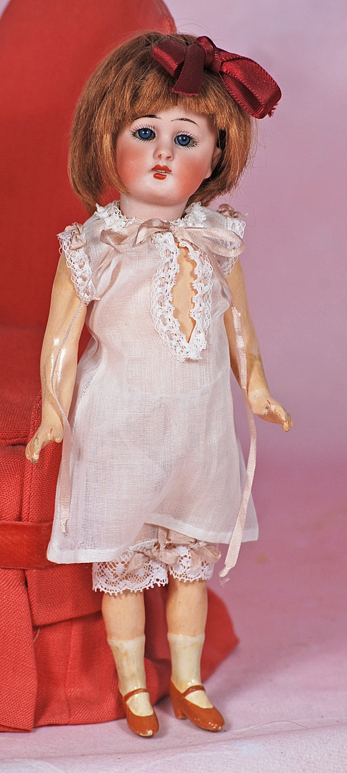 SIMON AND HALBIG BISQUE FLAPPER DOLL.: SIMON AND HALBIG BISQUE FLAPPER DOLL. 8 ½”. Marks: 1079, Simon & Halbig S & H Germany. Bisque socket head, blue sleep eyes, tapered brows, open mouth, upper teeth, brown human hair wig, o