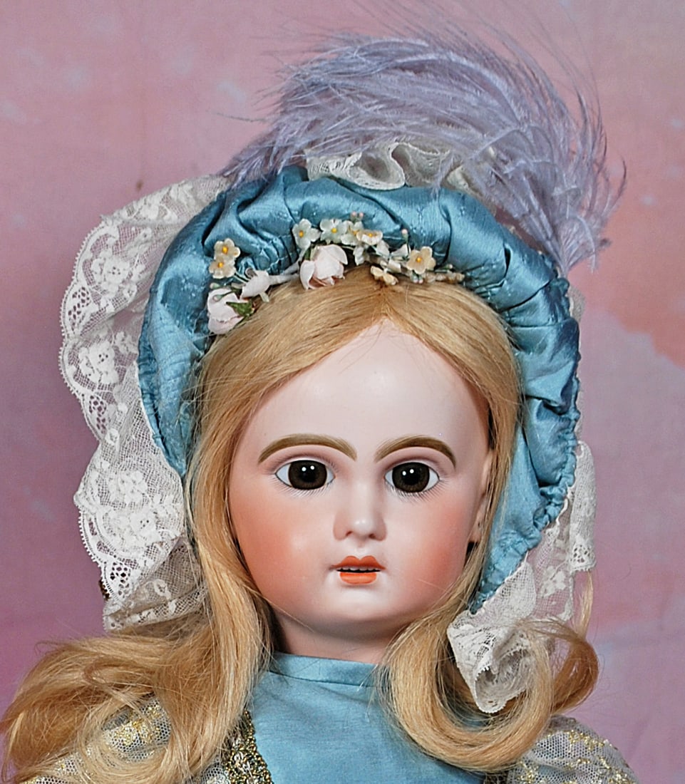 FRENCH BISQUE BEBE BY JUMEAU: 3. FRENCH BISQUE BEBE BY JUMEAU. 22”. Marks: 9. Bisque socket head, brown paperweight eyes, painted lashes, eyeliner, feathered brows, pierced ears, open mouth, accented lips, upper teeth, blond