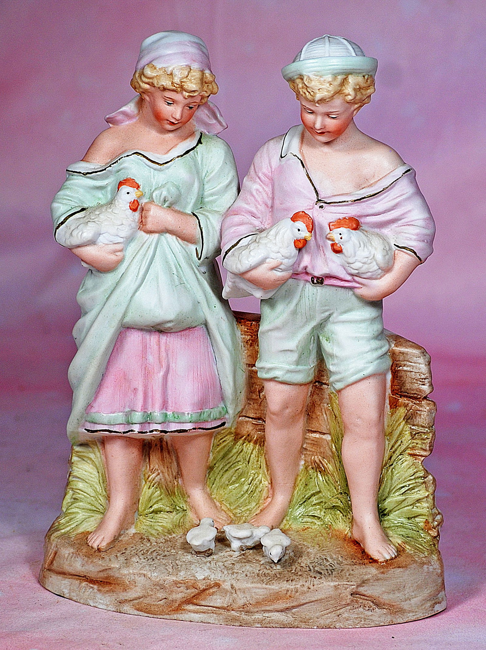 HEUBACH BISQUE FIGURINE OF COUPLE FEEDING CHICKS (1 of 1)