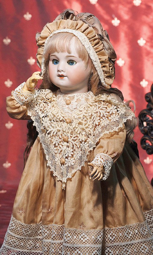 FRENCH BISQUE KISS-THROWING BEBE BY S.F.B.J. Mark: FRENCH BISQUE KISS-THROWING BEBE BY S.F.B.J. Marks: SFBJ 60. 21”. Bisque socket head, blue sleep eyes, original applied upper lashes, painted lower lashes, feathered brows, open mouth, upper teeth, 