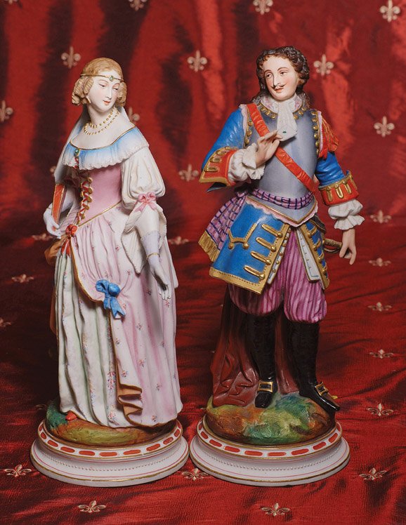PAIR OF FINE CONTINENTAL BISQUE FIGURES. 14 ½”. M: PAIR OF FINE CONTINENTAL BISQUE FIGURES. 14 ½”. Matched pair of figures are posed upon circular plinth base with painted and gilt decoration, posed before a woodland stump; depicts young woman and 