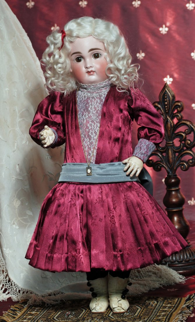 GERMAN BISQUE POUTY BY KESTNER. Marks: 14. 22". Bi: GERMAN BISQUE POUTY BY KESTNER. Marks: 14. 22". Bisque socket head, brown sleep eyes, painted lashes, feathered and brushstroked brows, closed mouth, modeled white space between shaded and accented li