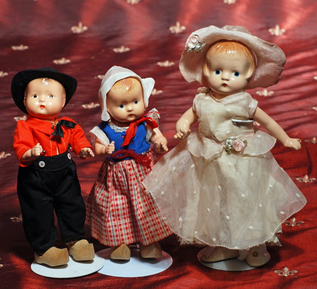 THREE COMPOSITION PATSY FAMILY DOLLS.: THREE COMPOSITION PATSY FAMILY DOLLS. Each has composition socket head and five-piece jointed composition body, painted features and hair. (1) 9 ½” marked Patsyette Doll wears original pale pink or