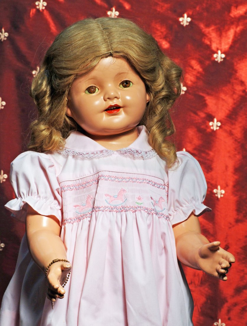 THREE COMPOSITION DOLLS.: THREE COMPOSITION DOLLS. 27” Effanbee Patsy Ruth, composition swivel head, shoulderplate and limbs, cloth torso, sleep eyes, original wig, metal heart bracelet, redressed; 14” composition Alexande