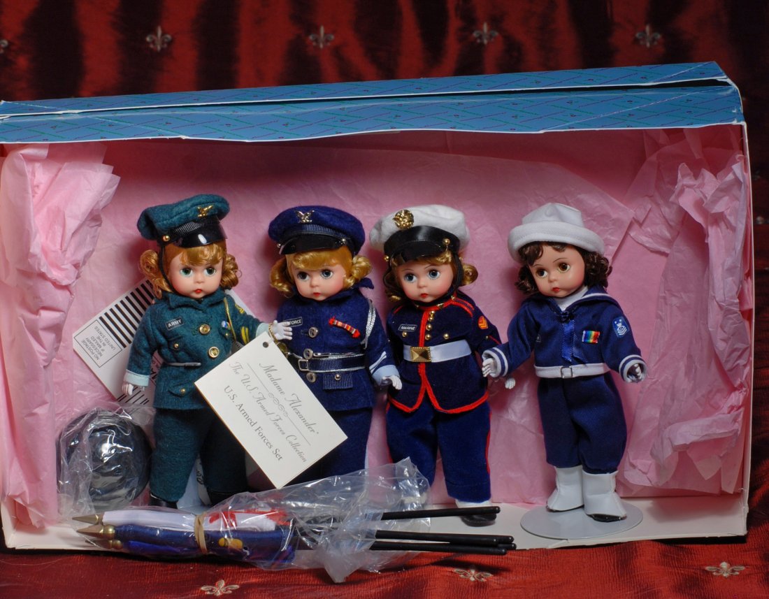 MADAME ALEXANDER ARMED FORCES SET: 305-A. MADAME ALEXANDER ARMED FORCES SET. 1997 edition featuring 8” Wendy in uniform of Navy, Army, Marines and Coast Guard with American flags. Mint-in-box.