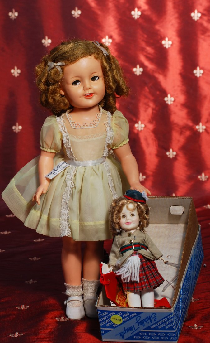 1957 FLIRTY-EYED SHIRLEY TEMPLE BY IDEAL & 8” SHIR: 306. 1957 FLIRTY-EYED SHIRLEY TEMPLE BY IDEAL & 8” SHIRLEY TEMPLE. Marks: Ideal Doll ST-17. Vinyl socket head, flirty eyes, rooted blonde hair, tagged yellow organdy party dress, white suede shoes.