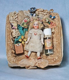 MINIATURE BISQUE DOLL IN PRESENTATION BOX