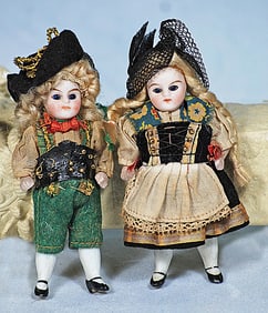 PAIR OF GERMAN ALL-BISQUE DOLLS IN FOLK LORE COSTUME