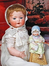 GERMAN BISQUE CHARACTER BABY WITH BISQUE PIANO BABY FIGURE