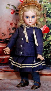 PETITE FRENCH BISQUE BEBE E: PETITE FRENCH BISQUE BEBE E.J. BY EMILE JUMEAU. 13 ½”. Marks: Depose E 5 J. Bisque socket head, blue paperweight eyes, painted lashes, eyeliner, feathered brows, pierced ears, closed mouth,