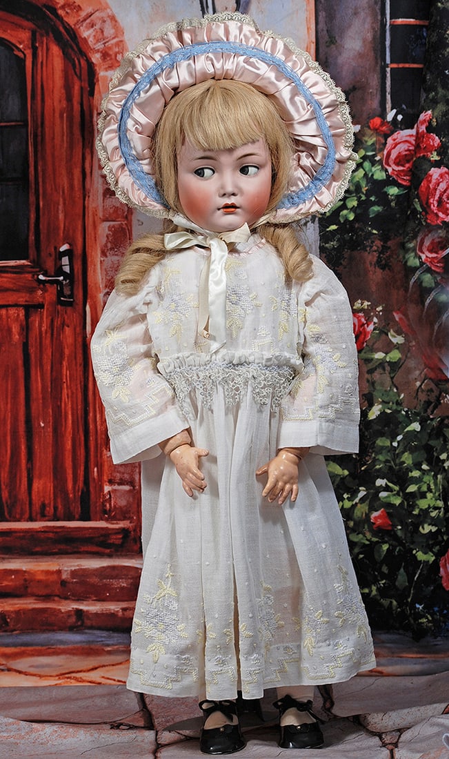 GERMAN BISQUE FLIRTY-EYED CHILD BY KAMMER AND REINHARDT: GERMAN BISQUE FLIRTY-EYED CHILD BY KAMMER AND REINHARDT. 29”. Marks: K * R Simon & Halbig 117n. Bisque socket head, blue flirty and sleep eyes, painted lashes, eyeliner, feathered brows, open mo
