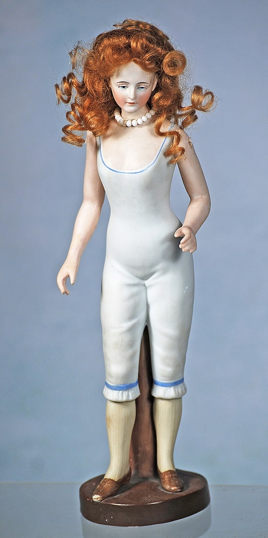 GERMAN ALL-BISQUE LADY BY GALLUBA AND HOFFMAN: GERMAN ALL-BISQUE LADY BY GALLUBA AND HOFFMAN. 10”. Bisque lady with painted features, blue downcast eyes, upper eyeliner, tapered brows, closed mouth, auburn mohair wig, clad in white body suit