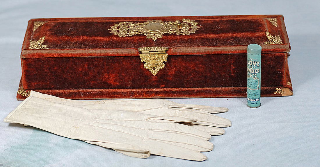 ANTIQUE BRUSHED VELVET GLOVE BOX WITH GLOVES: ANTIQUE BRUSHED VELVET GLOVE BOX WITH GLOVES. 13 ½” x 4 ½: x 2 ½”. Velvet covered wooden glove box with gilt metal lace and decorations, pink sateen lining, includes bone gl