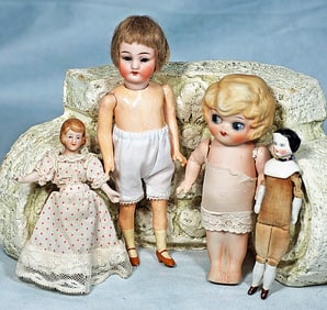 FOUR BISQUE DOLLS