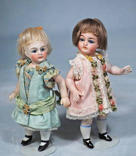 TWO GERMAN ALL-BISQUE DOLLS: TWO GERMAN ALL-BISQUE DOLLS. 5 ¾” and 6”. Each is all-bisque with swivel neck and five-piece jointed bisque body, stationary blue glass eyes, tapered brows, closed mouth, mohair wig,