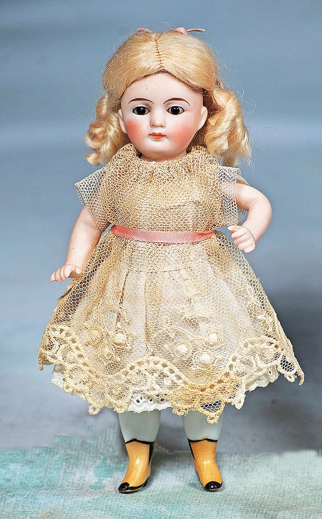 MINIATURE GERMAN ALL-BISQUE DOLL WITH YELLOW BOOTS (1 of 1)