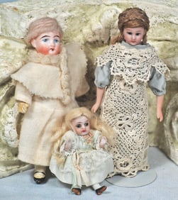 THREE BISQUE DOLLS
