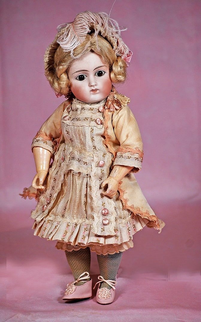 GERMAN BISQUE CLOSED-MOUTH DOLL BY MYSTERY MAKER: GERMAN BISQUE CLOSED-MOUTH DOLL BY MYSTERY MAKER. 12”. Marks: 9. Bisque socket head, stationary brown glass eyes, painted lashes, multi-stroked brows, very full cheeks, closed mouth, modeled thi