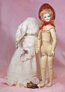 FRENCH BISQUE POUPEE BY BRU WITH DEPOSED WOODEN ARTICULATED BODY: FRENCH BISQUE POUPEE BY BRU WITH DEPOSED WOODEN ARTICULATED BODY. 15 &#189;&#8221;. Marks: E. Bisque swivel head on bisque shoulderplate, inset blue paperweight eyes, painted lashes, eyeliner, feather