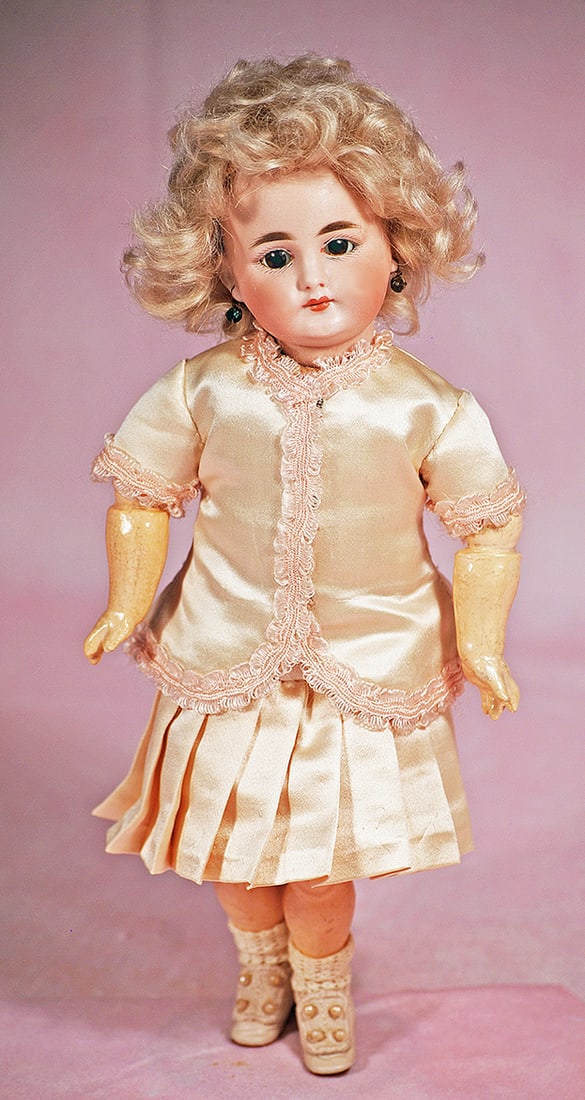 RARE, PETITE CLOSED-MOUTH BISQUE CHILD, 719, BY SIMON AND HALBIG: RARE, PETITE CLOSED-MOUTH BISQUE CHILD, 719, BY SIMON AND HALBIG. 10 ½”. Marks: S & H 719 Dep. Bisque socket head, stationary brown glass eyes, painted lashes, feathered brows, pierced ears