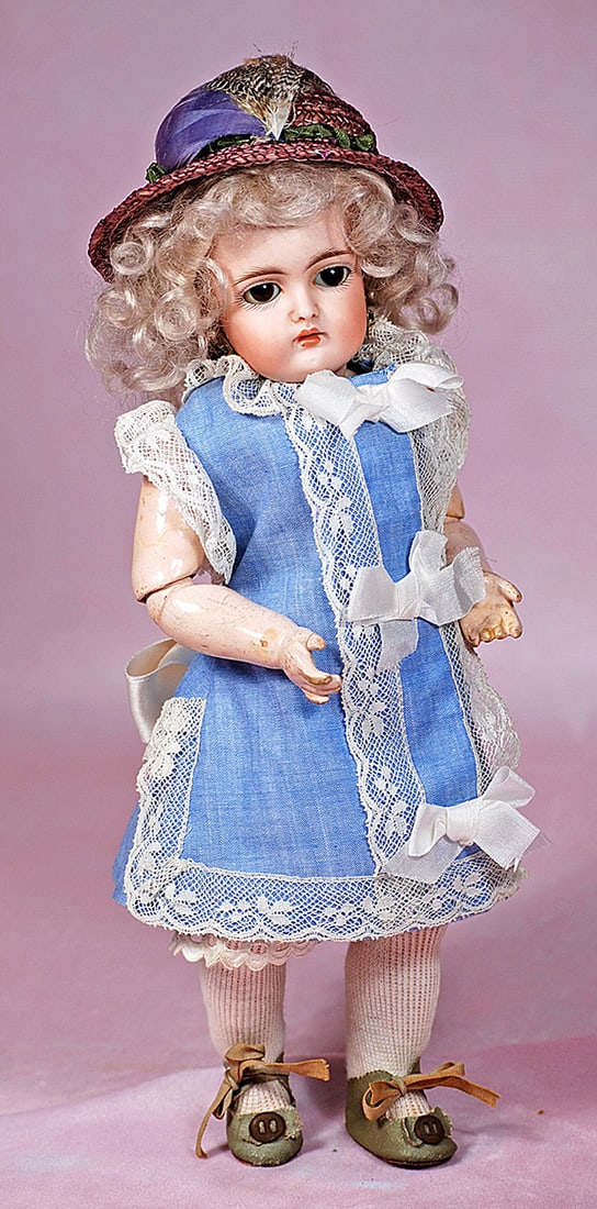 PETITE GERMAN BISQUE CHILD, 152, BY KESTNER: PETITE GERMAN BISQUE CHILD, 152, BY KESTNER. 10 ½”. Marks: 152. Bisque socket head, brown sleep eyes, painted lashes, feathered brows, pierced ears, open mouth, accented lips, upper teeth,