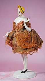 GERMAN PORCELAIN HALF DOLL IN YELLOW BONNET WITH PORCELAIN LEGS