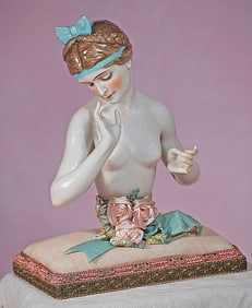 GRAND SIZE GERMAN PORCELAIN HALF DOLL WITH BRAIDS AND HAIR RIBBON
