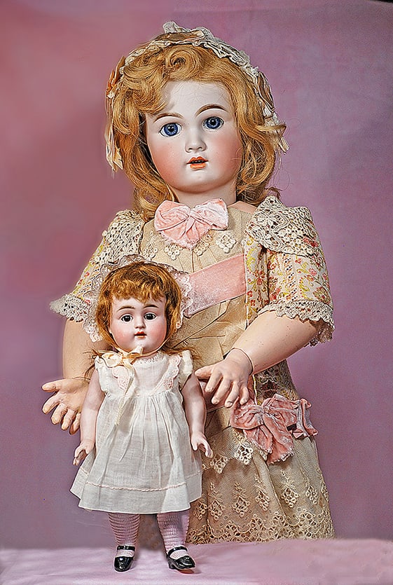 FRENCH BISQUE BEBE BY JUMEAU: FRENCH BISQUE BEBE BY JUMEAU. 27”. Marks: Tete Jumeau (red stamp) 12. Bisque socket head, stationary blue glass eyes, eyeliner, painted lashes, feathered brows, open mouth, accented lips, upper