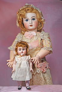 FRENCH BISQUE BEBE BY JUMEAU: FRENCH BISQUE BEBE BY JUMEAU. 27&#8221;. Marks: Tete Jumeau (red stamp) 12. Bisque socket head, stationary blue glass eyes, eyeliner, painted lashes, feathered brows, open mouth, accented lips, upper