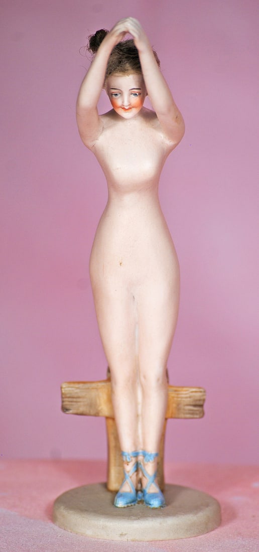 GERMAN BISQUE NUDE LADY BY GALLUBA AND HOFFMAN: GERMAN BISQUE NUDE LADY BY GALLUBA AND HOFFMAN. 5 ¾”. All-bisque figure of nude lady with arms posed upward standing in front of bisque fence with circular base, painted features, original