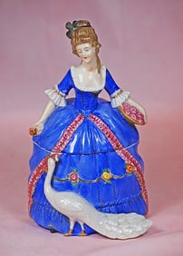 GERMAN PORCELAIN LADY WITH PEACOCK AS POWDER JAR