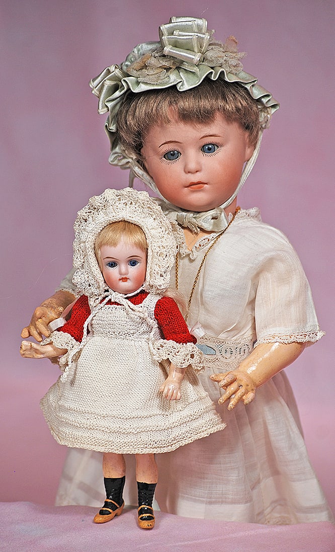 TINY GERMAN CLOSED-MOUTH DOLL BY KAMMER AND REINHARDT: TINY GERMAN CLOSED-MOUTH DOLL BY KAMMER AND REINHARDT. 6”. Marks: 192. Bisque socket head, stationary blue glass eyes, painted lashes, tapered brows, closed mouth, original blonde mohair wig, fi