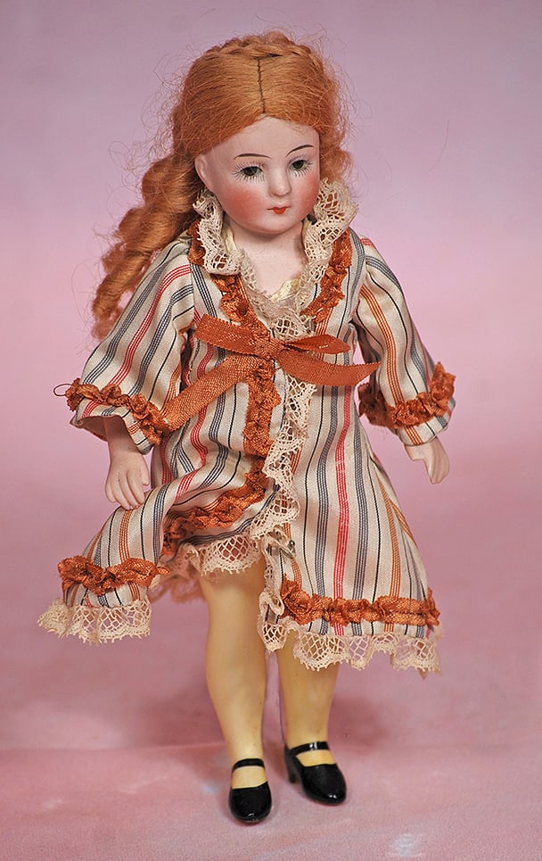 GERMAN ALL-BISQUE DOLL WITH LONG YELLOW STOCKINGS (1 of 1)