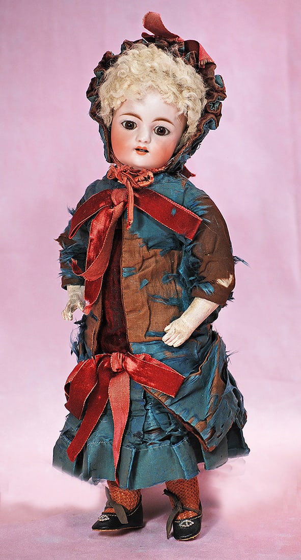 RARE SIMON AND HALBIG, MODEL 908, BISQUE CHILD: RARE SIMON AND HALBIG, MODEL 908, BISQUE CHILD. 12 ½”. Marks: S H 5, 908. Bisque socket head, stationary brown glass eyes, painted lashes, eyeliner, feathered brows, open mouth, accented li